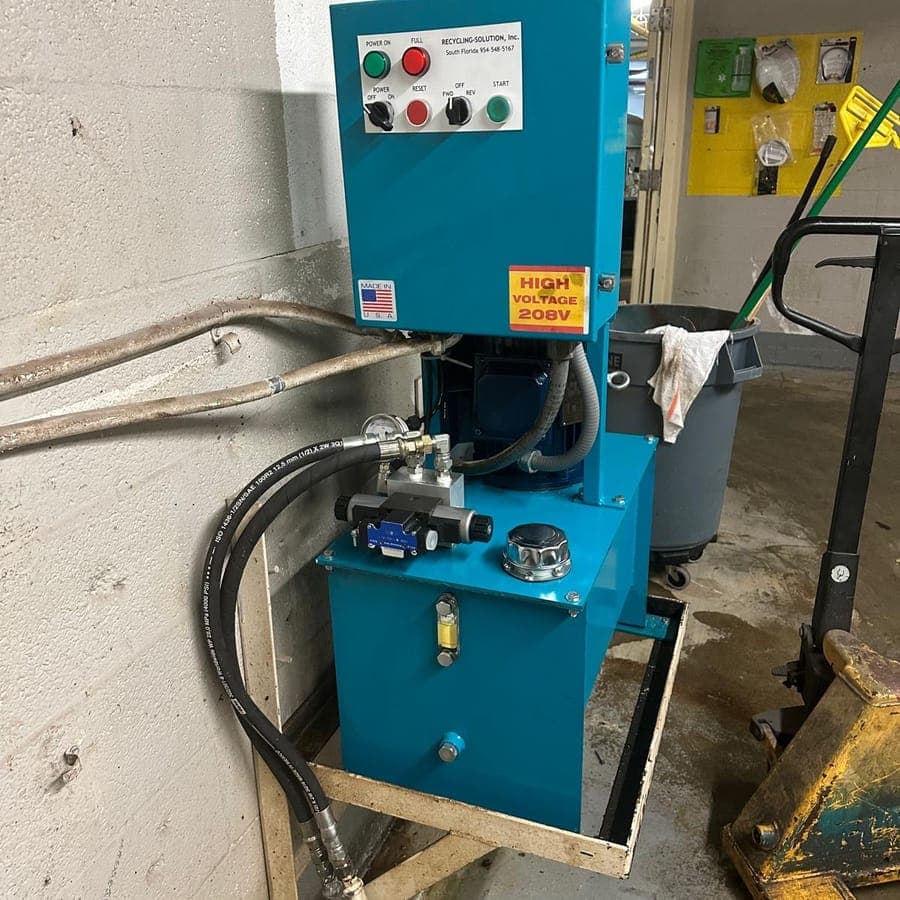 A hydraulic power pack with its control panel, motor, pump and oil tank