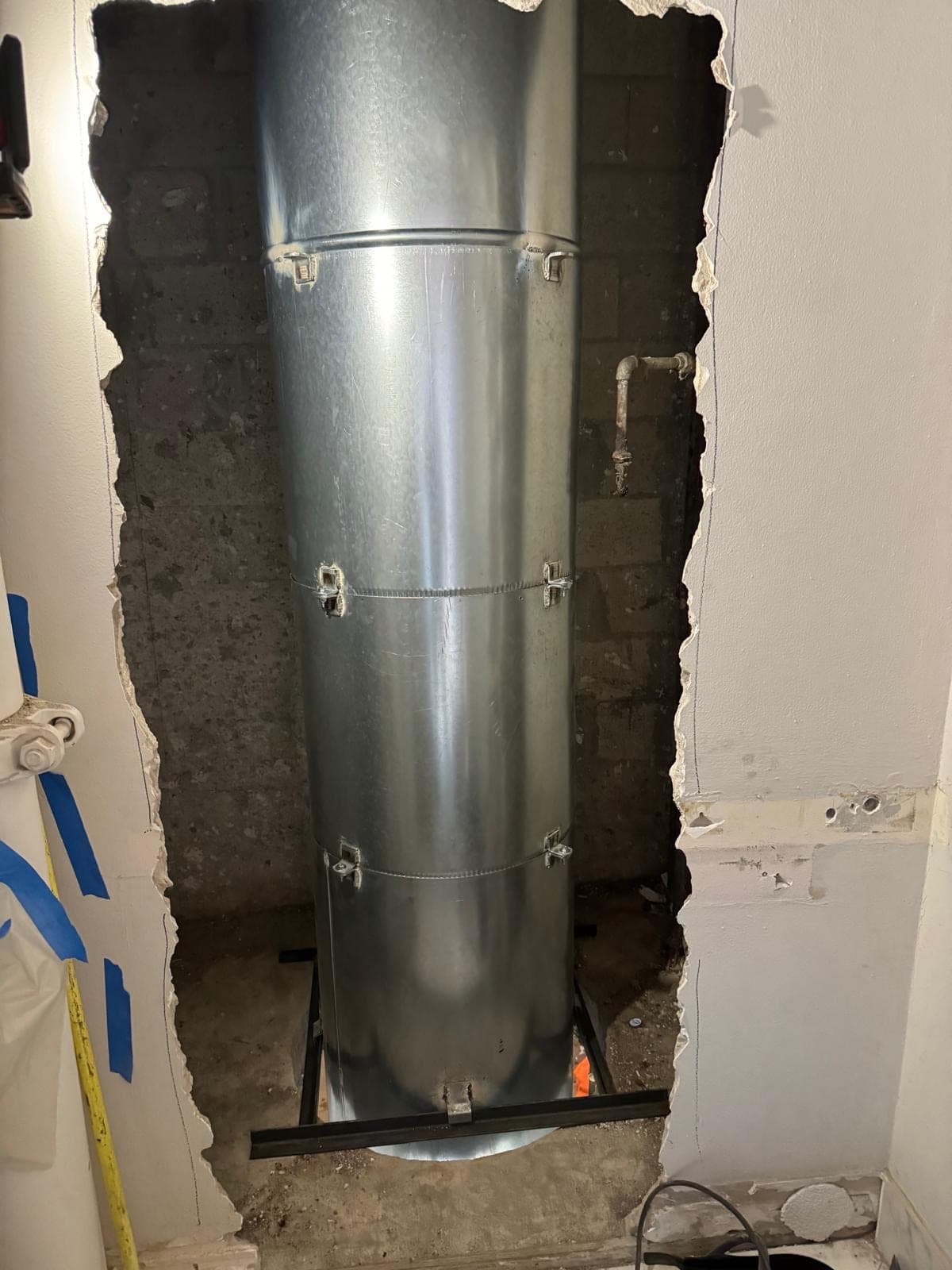 A new steel chute fitted and squared up in the same wall