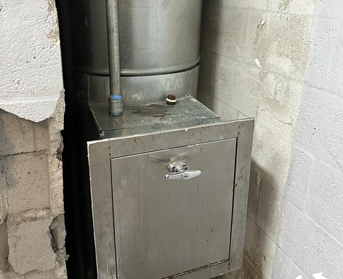A clean new chute section in the same wall opening